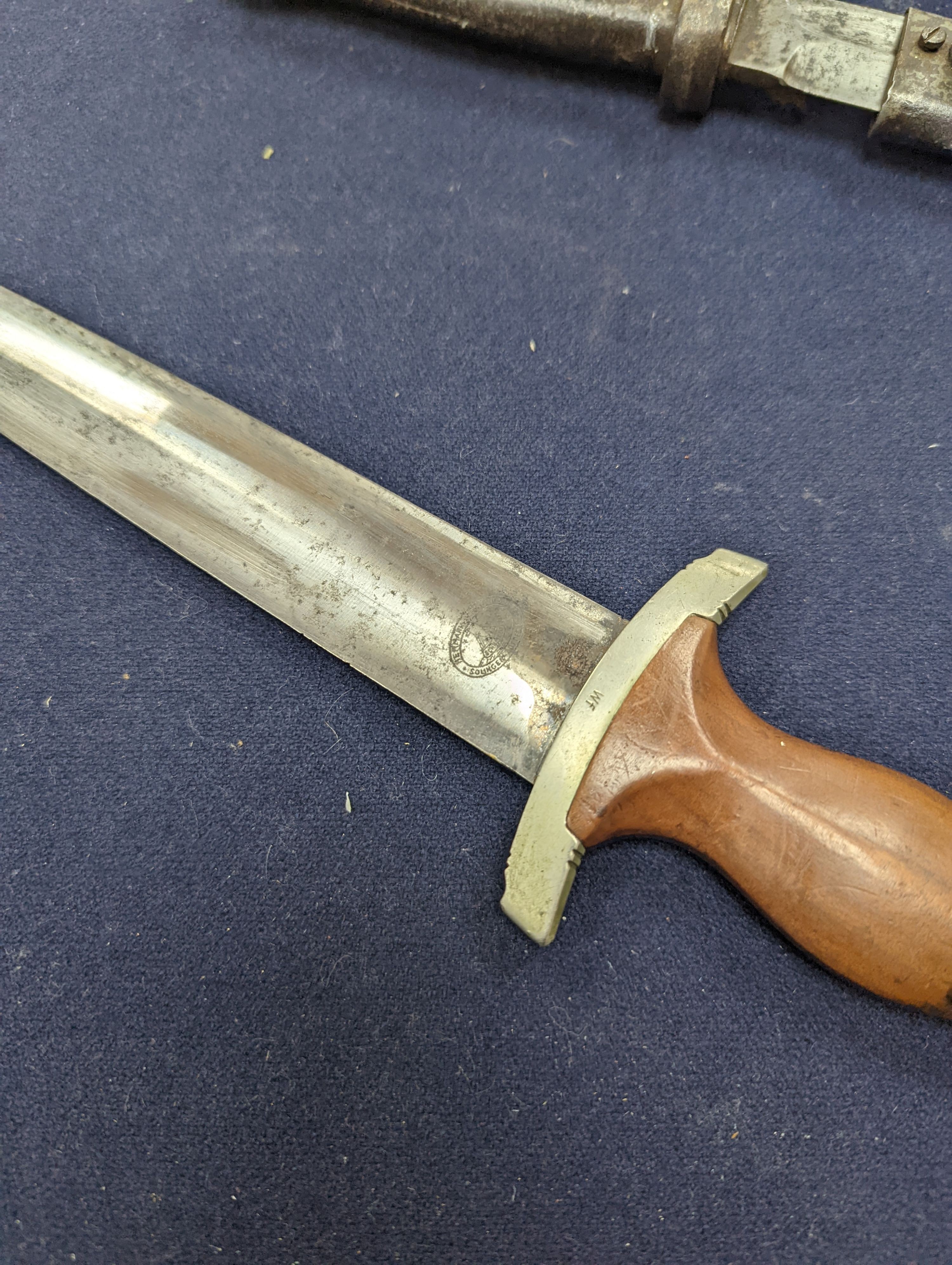 A Third Reich SA dagger within sheath, blade 22cm., and a bayonet within scabbard